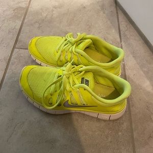 Neon yellow Nike shoes